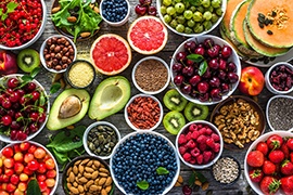 Birds eye view of healthy foods in bowls on a wooden table
